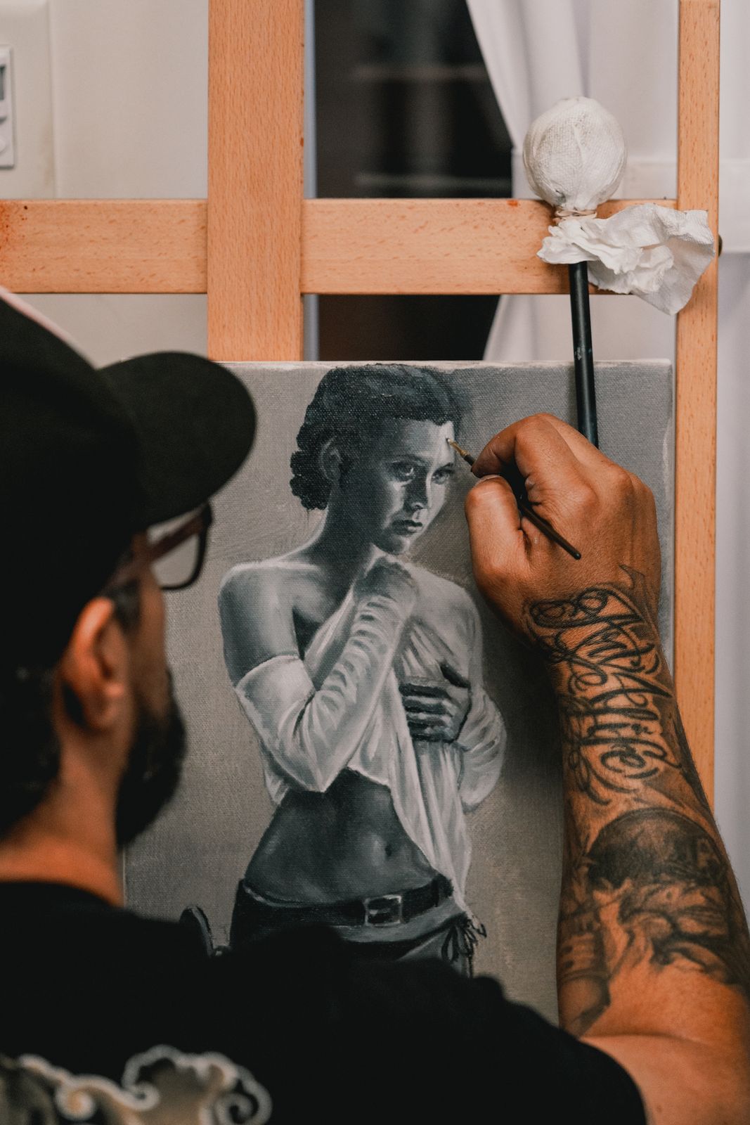 Artist painting a portrait at the Fine Ink Academy