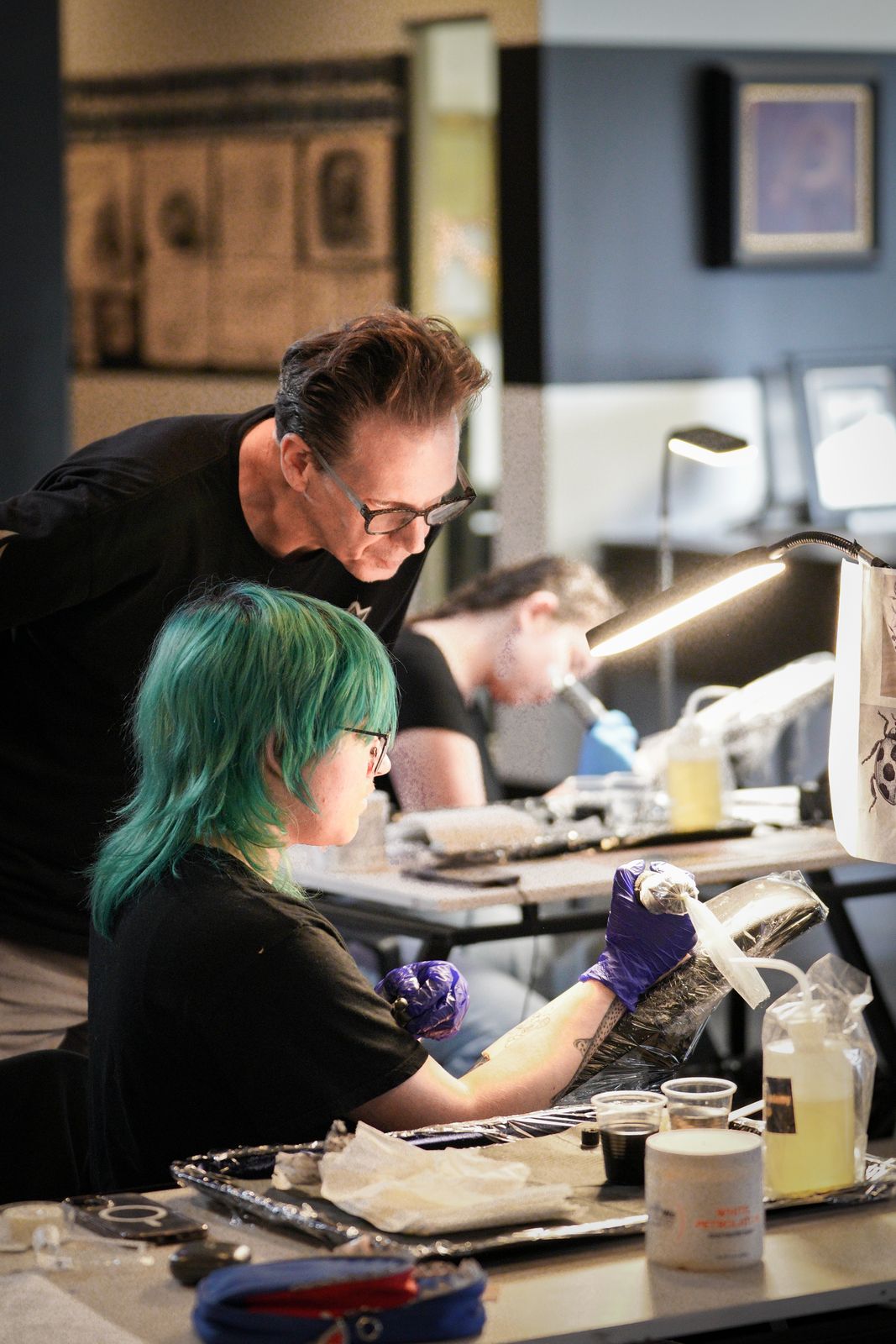 Fine Ink Academy instructor coaching a student