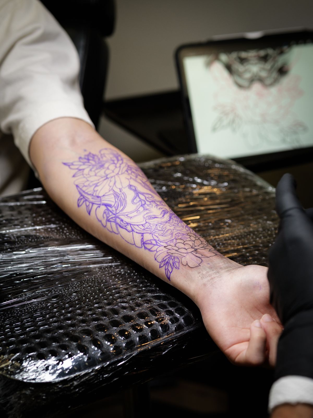 Stencil placed on a forearm, ready to tattoo